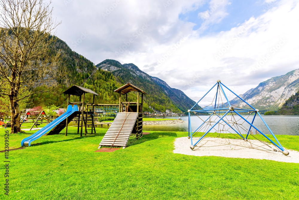 The children playground by the lake in village of UNESCO world heritage of Hallstatt, Austria. The children playground by the lake in village of UNESCO world heritage of Hallstatt, Austria.
