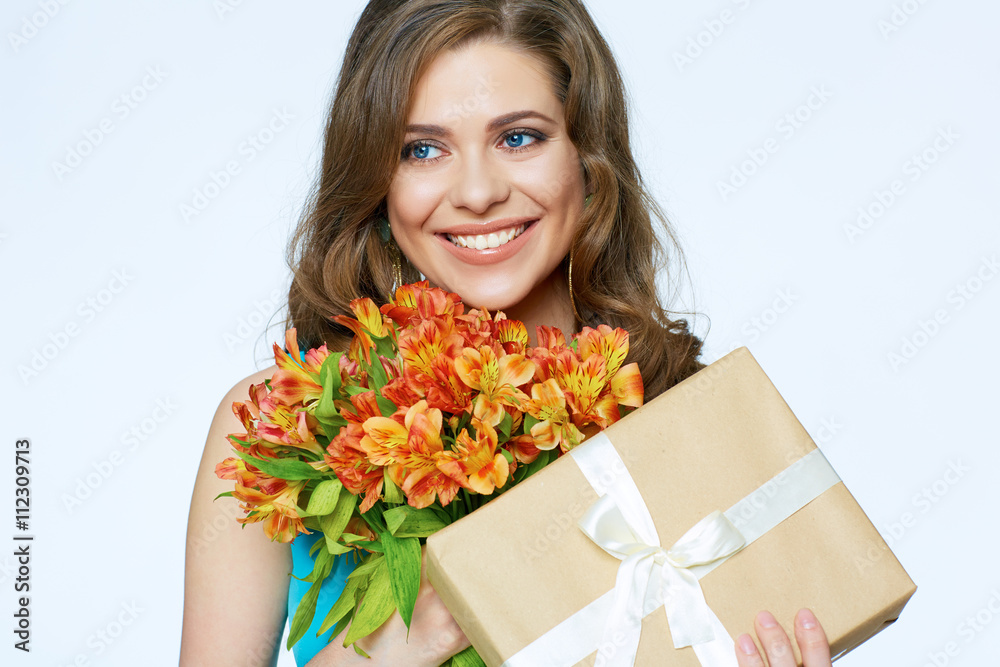 Face close up woman portrait with flowers and gift box. Face close up woman portrait with flowers and gift box.
