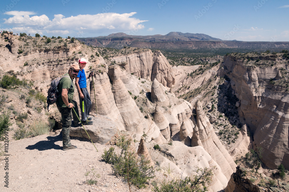 Family on top of the mountain. Kasha-Katuwe Tent Rocks  National Monument