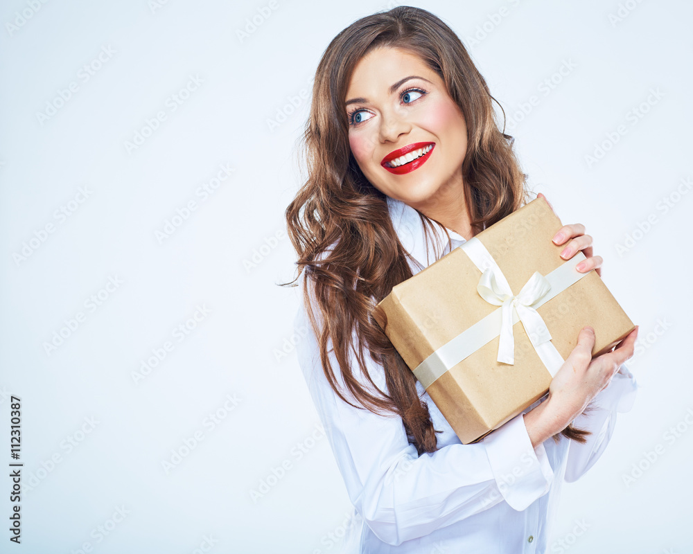 Modern smiling business woman holding gift box. Modern smiling business woman holding gift box.