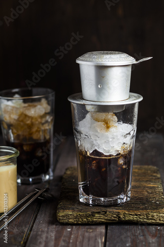 Preparation of vietnamese iced coffee, coffee filter photo