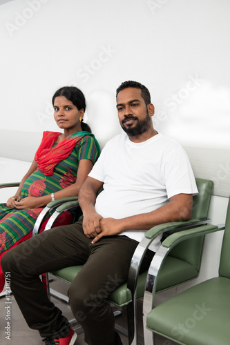 .Hindu couple sitting in the waiting room