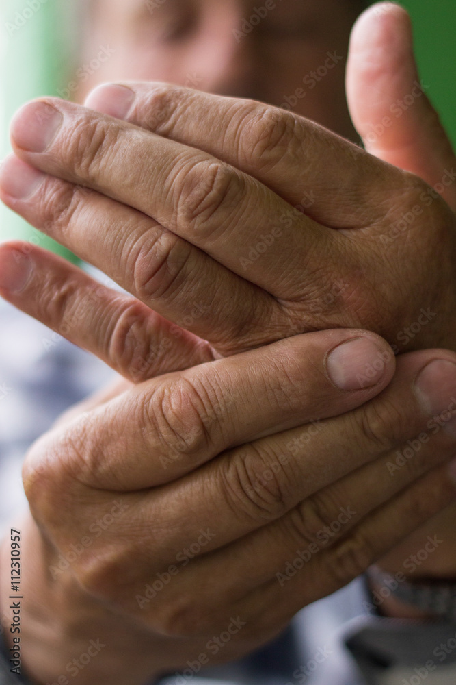 Fototapeta premium Clenched painful hands 