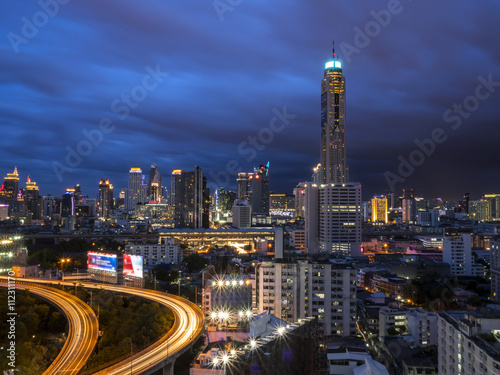 Night light cityscape and modern building with high view in Bangkok, Thailand under sky and cloud in twilight time