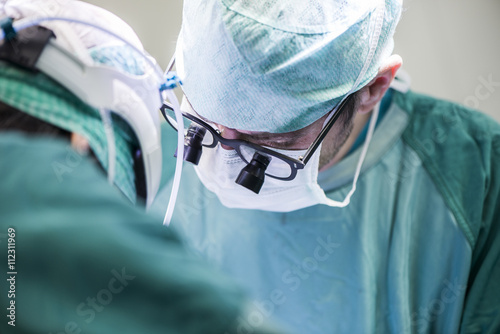 Surgeons during an operation photo