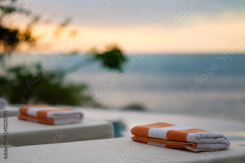 Towels on sun loungers by the sea photo