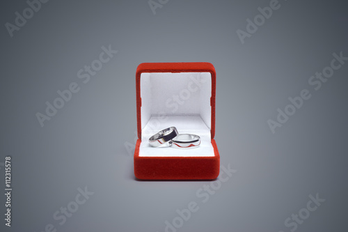 wedding rings on a wooden table