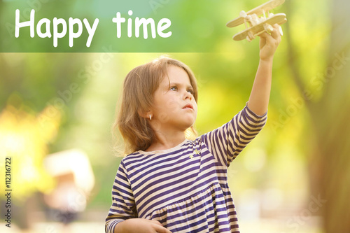 Little girl plays with wood...