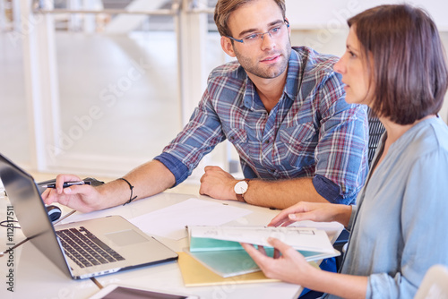 Fényképezés Male and female students working together on a project