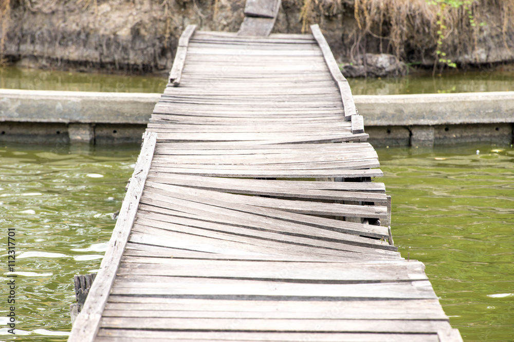 Old wreck wooden bridge for crossing the river.