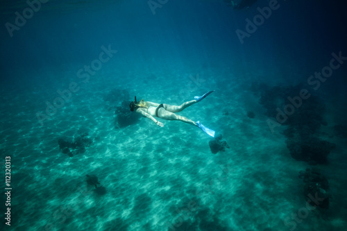 Sexy Woman snorkeling underwater