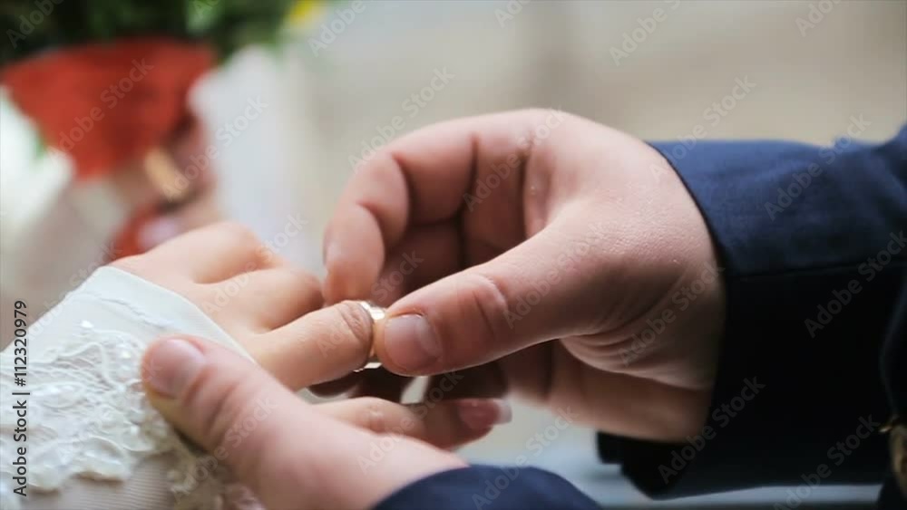 groom wears gold ring bride groom wears gold ring bride