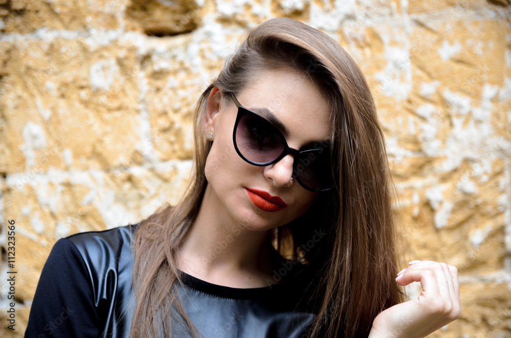 portrait of model posing outdoors in black leather clothes portrait of model posing outdoors in black leather clothes