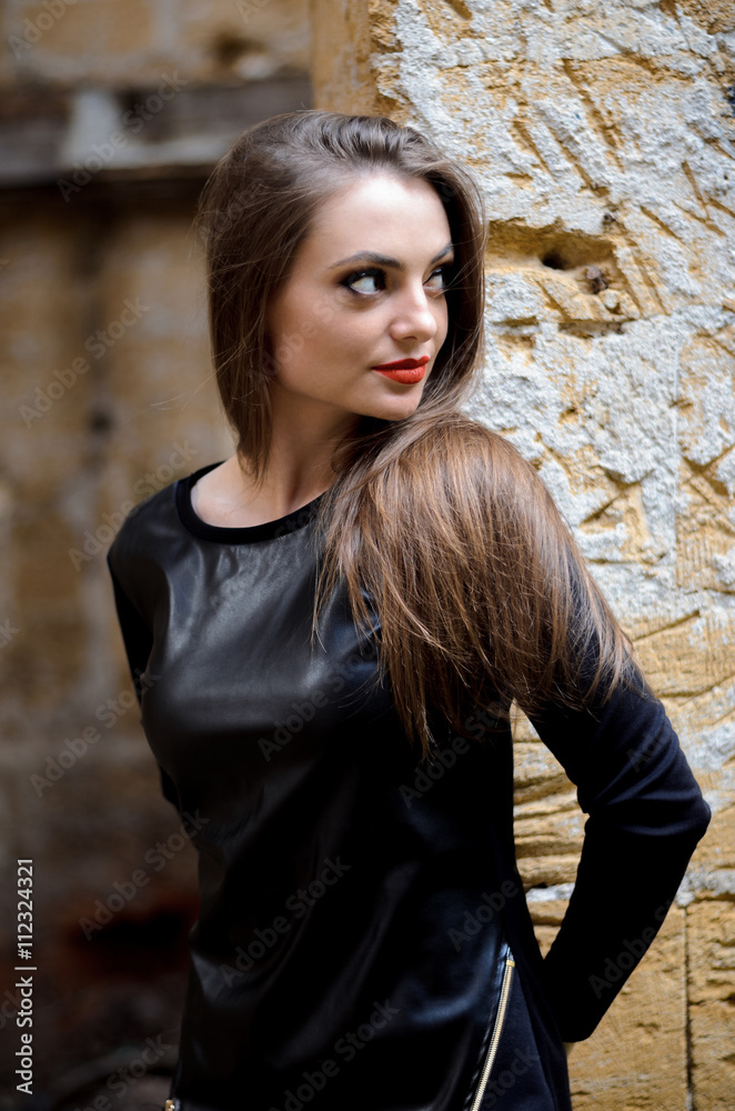 portrait of model posing outdoors in black leather clothes portrait of model posing outdoors in black leather clothes