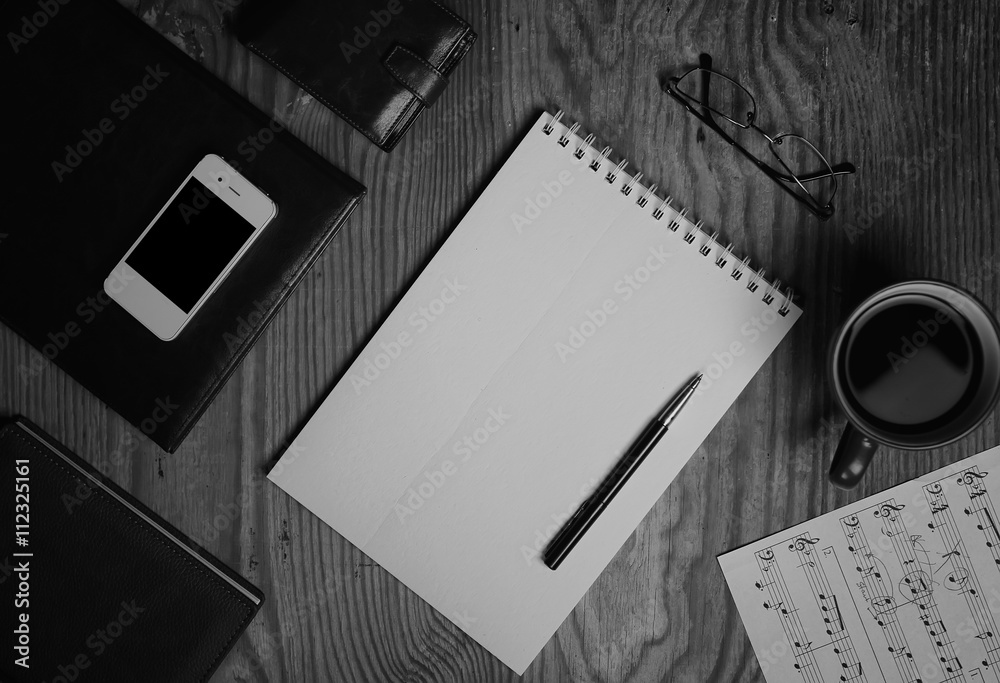 Fototapeta premium monochrome notebook paper writing tools