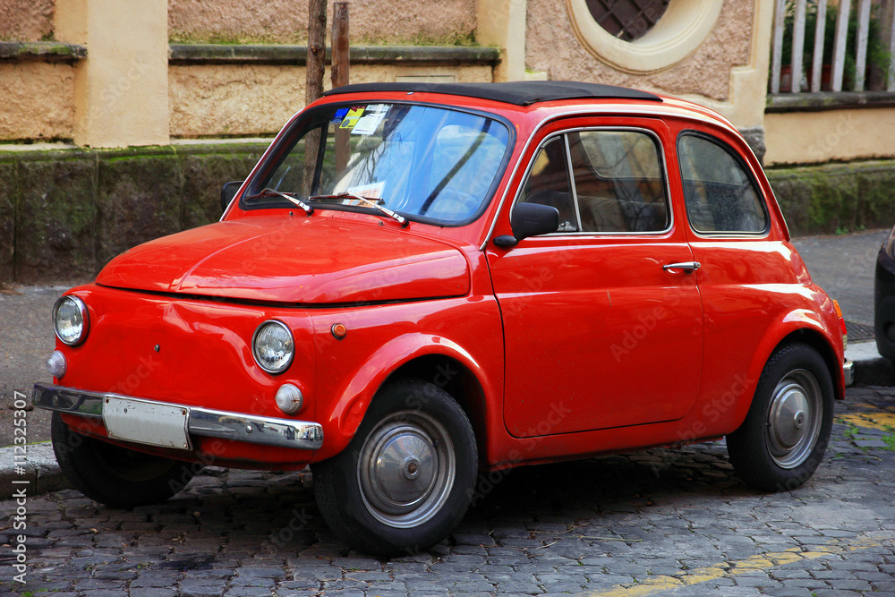 Fényképezés funny red small old little italian car with round headlights  and - az Europosters.hu