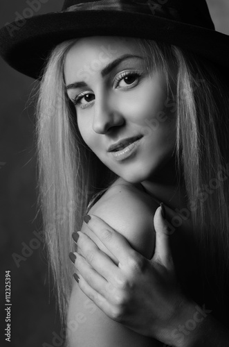 Portrait of beautiful blonde girl in hat