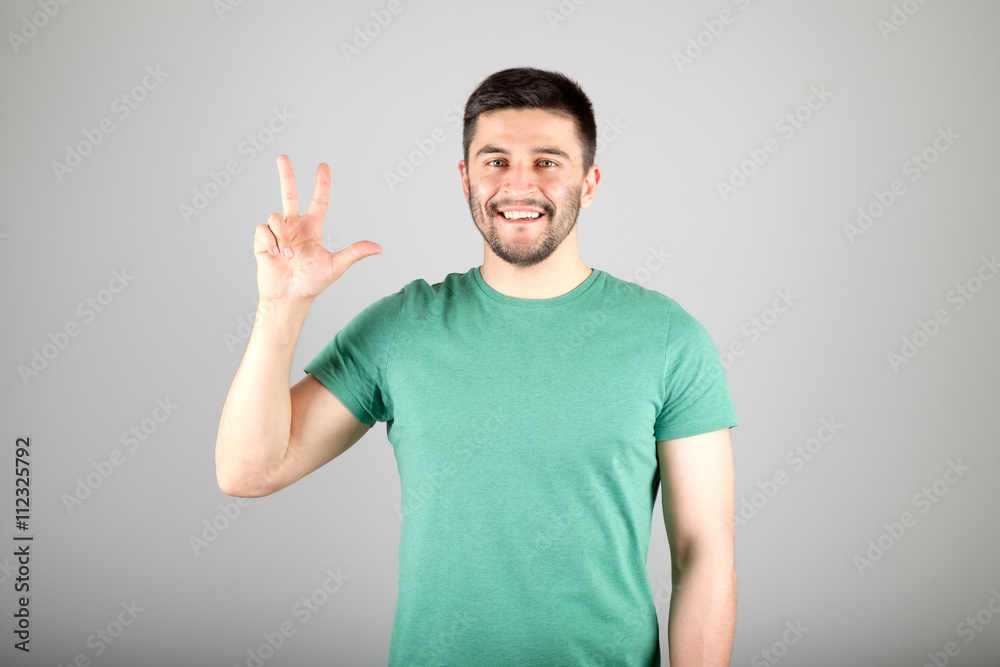 Man showing number by fingers Man showing number by fingers