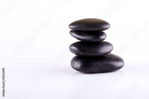 Few black lava stones stacked at each other