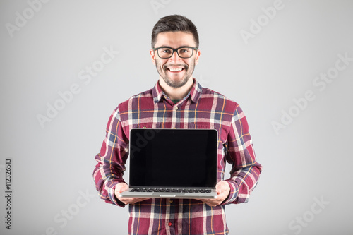Man with laptop showing screeen
