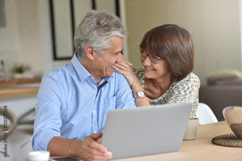 Senior couple using laptop computer at home Senior couple using laptop computer at home