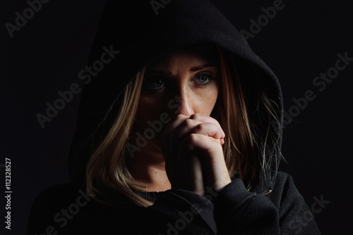 Obraz na płótnie Praying woman in hood. Nun. w salonie