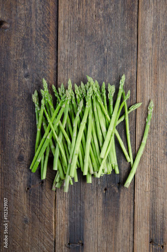 Fresh Green Asparagus on wooden table. Top view.