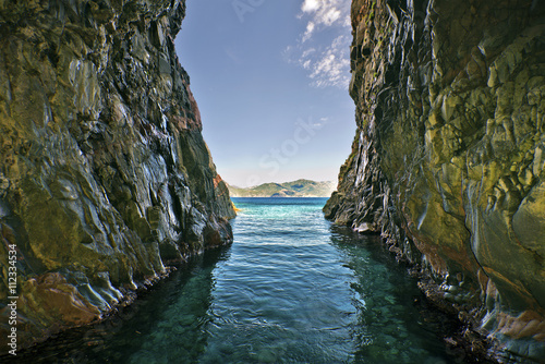 Schilderij op canvas View from a grotto in Scandola Nature reserve in Corsica