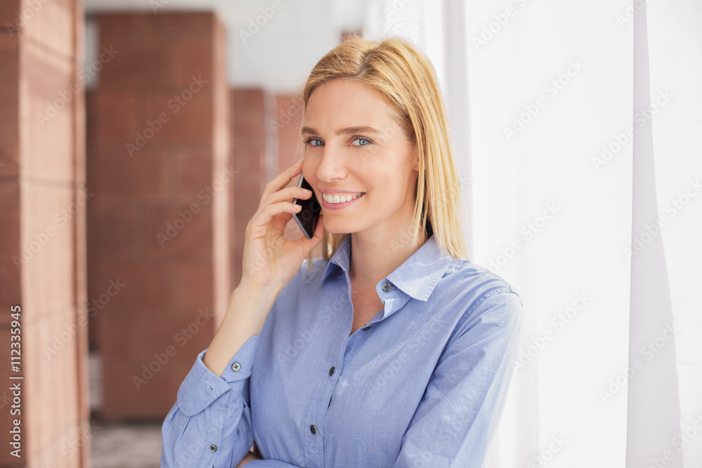 Beautiful young woman in office hall Beautiful young woman in office hall