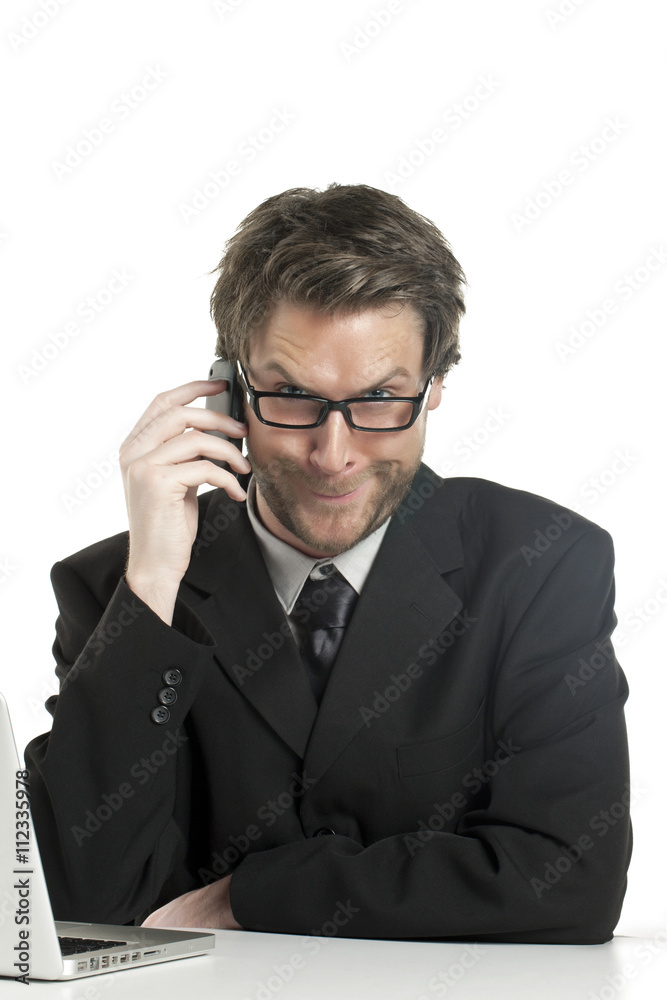 businessman making funny face while talking on the phone