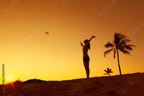 Woman feeling free in a beautiful nature setting! Tropical holiday getaway. 