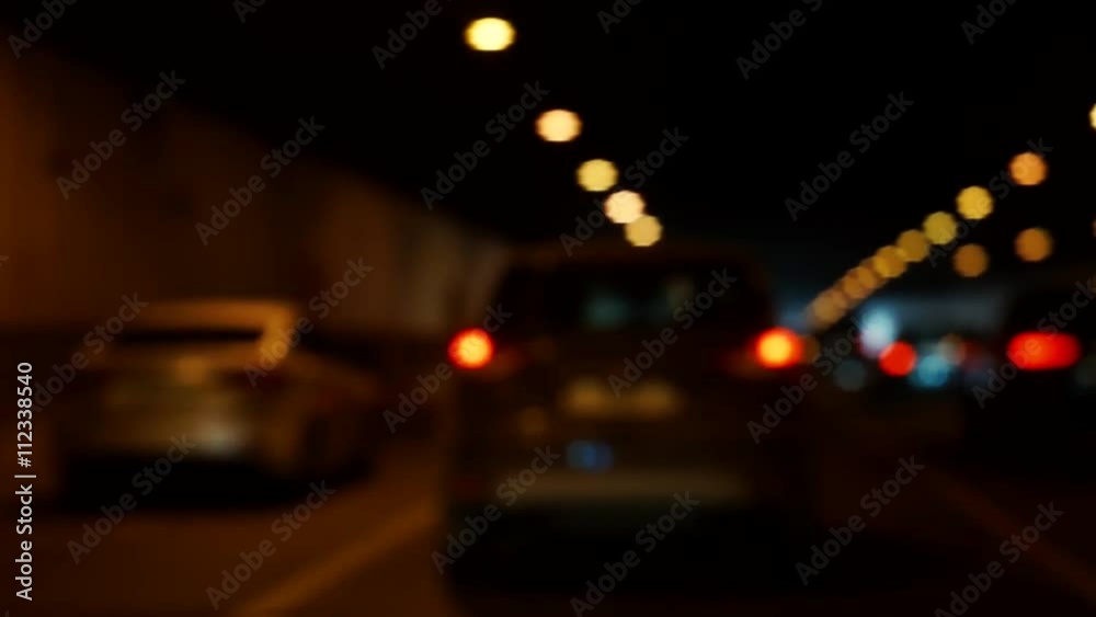 Blurry Video background. The movement of vehicles on the highway. Exit from the tunnel.