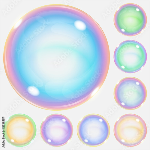 Set of multicolored transparent soap bubbles with glares. Transparency only in vector format. Can be used with any background