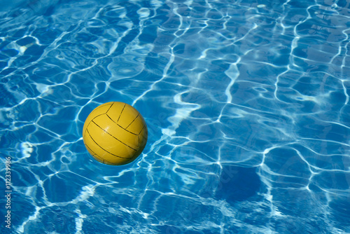 Yellow ball in the pool