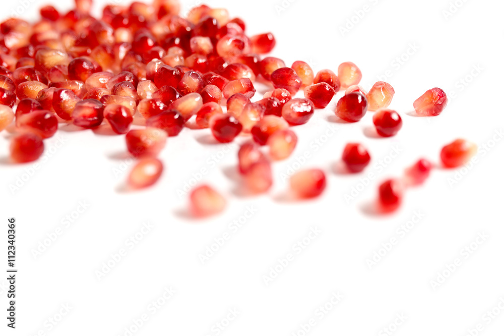 Seeds of pomegranate on a white background Seeds of pomegranate on a white background