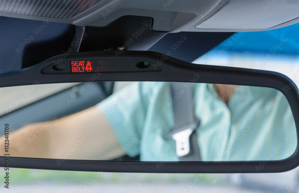 Seatbelt sign showing on the Car Rearview Mirror