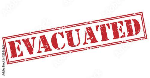 Φωτογραφία evacuated red stamp on white background