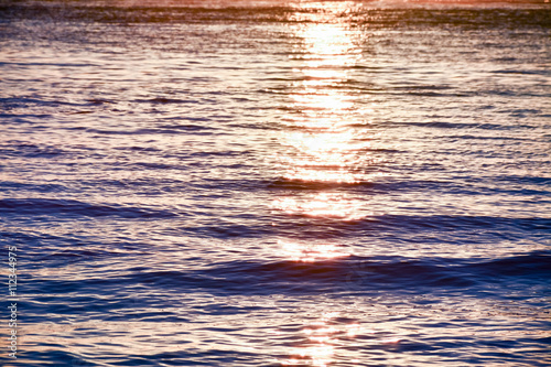 The sunlight that is reflected in the sea water at sunset