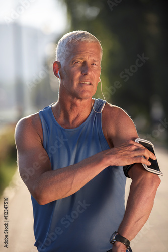 portrait of handsome senior jogging man