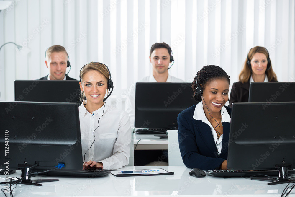 Call Center Operators Working On Computers Call Center Operators Working On Computers
