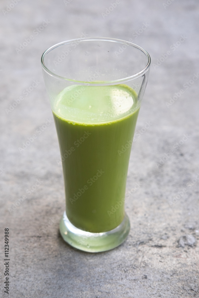 Matcha green tea latte beverage in glass Matcha green tea latte beverage in glass