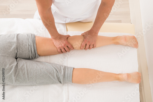 Therapist Giving Leg Massage