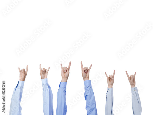 different hands gesturing rock and roll sign