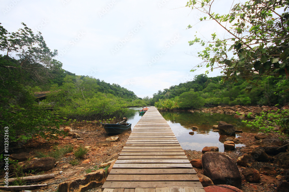 The wooden bridge on the island of Mangrove forest thailand