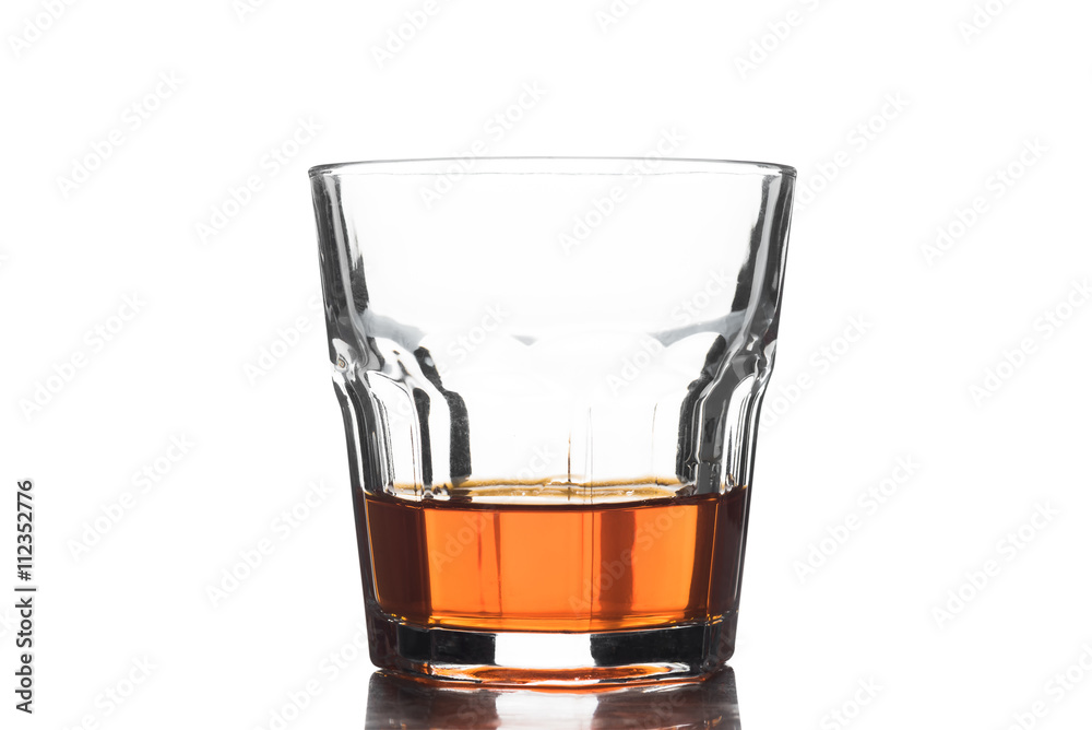 Glass of scotch whiskey on a white background Glass of scotch whiskey on a white background