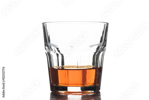 Glass of scotch whiskey on a white background