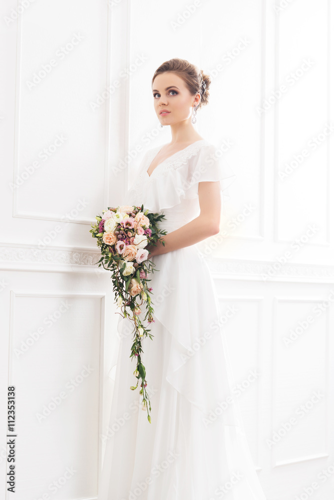Young and beautiful bride with bouquet Young and beautiful bride with bouquet