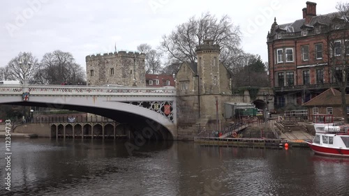 York England Lendal Bridge traffic over Ouse River. York a historic walled city founded by the Romans in 71 AD. Settle since 8000 BC. The York Minister Cathedral built on 1080. photo