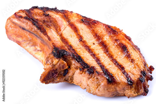 grilled pork chop on white background. close-up