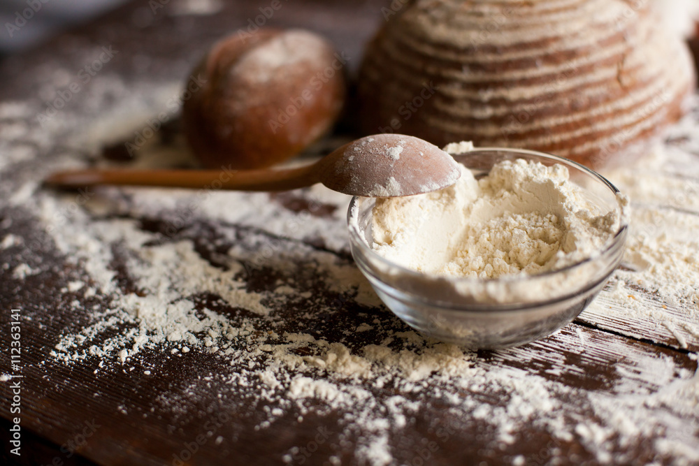 Fototapeta premium Bread and flour on the table